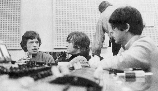 The Beatles in studio with Mick Jagger